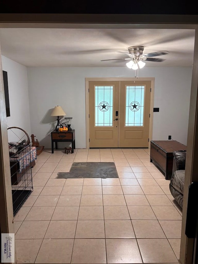 entrance foyer with a ceiling fan and light tile patterned flooring