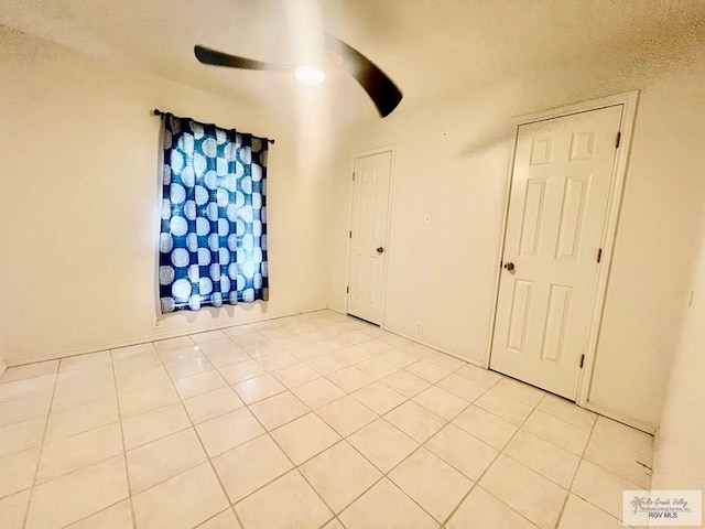 spare room featuring light tile patterned floors