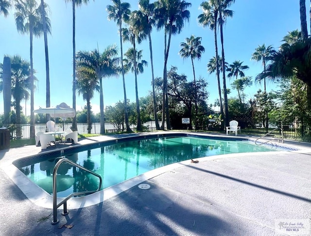 view of swimming pool featuring a patio