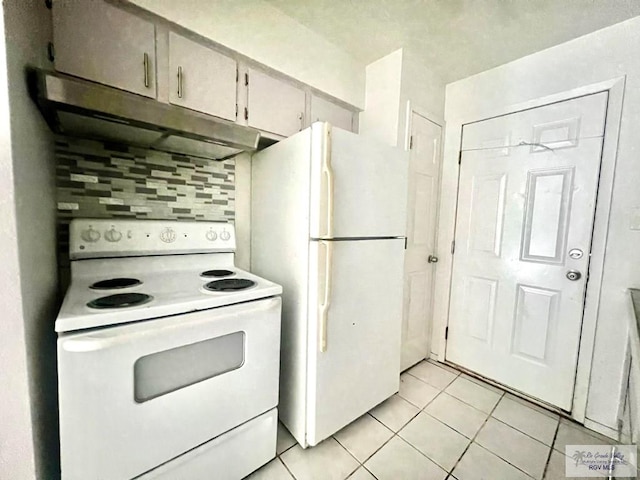 kitchen featuring decorative backsplash, white appliances, and light tile patterned flooring