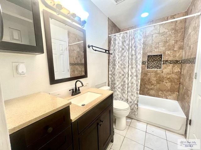 full bathroom with tile patterned flooring, vanity, toilet, and shower / tub combo