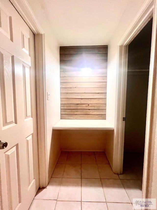 hallway with light tile patterned floors