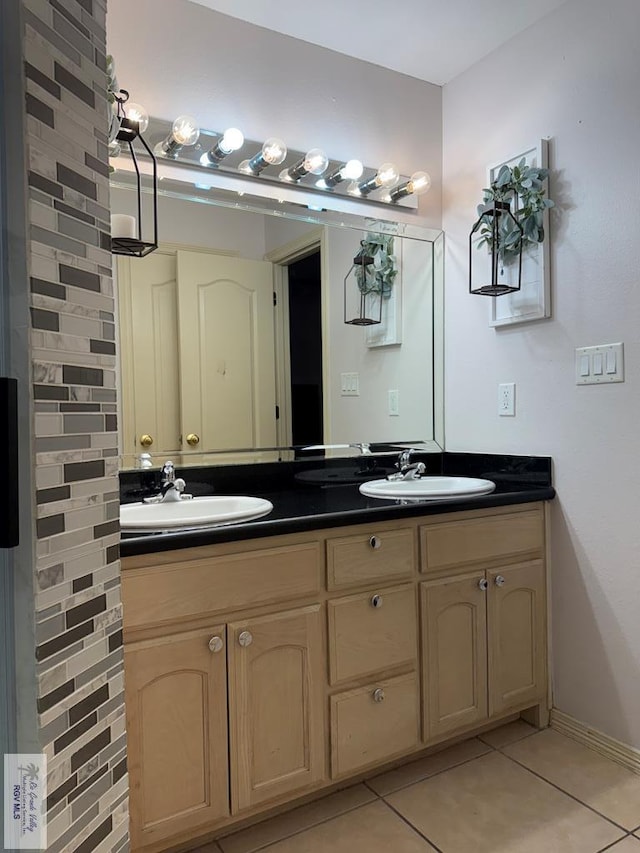 bathroom with tile patterned floors and vanity