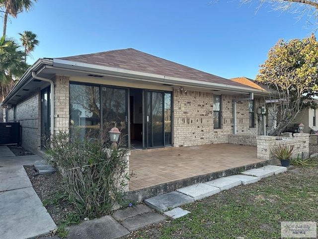 back of property featuring a patio and central air condition unit