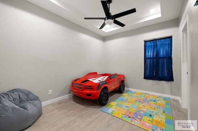 bedroom with ceiling fan and light wood-type flooring