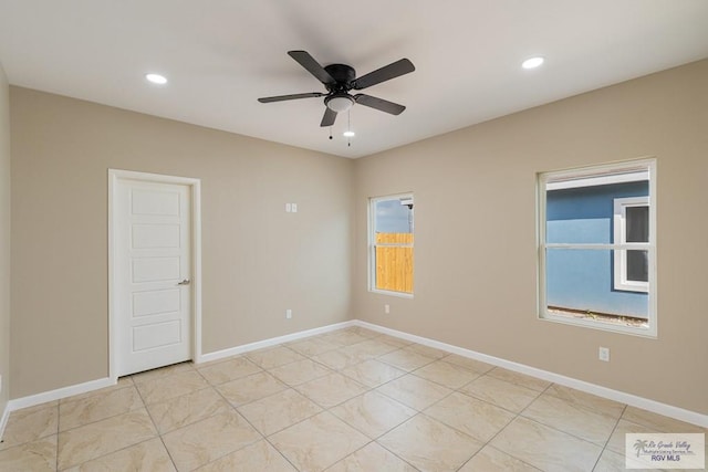 unfurnished room with ceiling fan