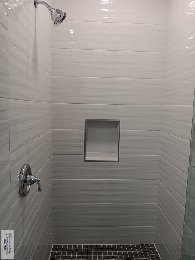 room details with a tile shower