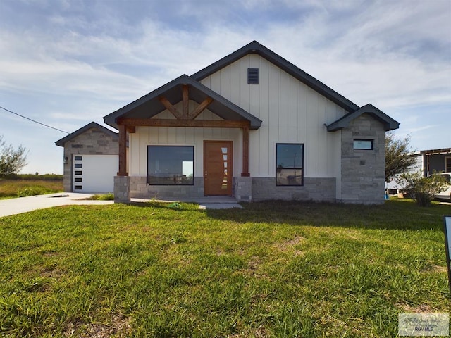 view of front of property with a garage and a front lawn