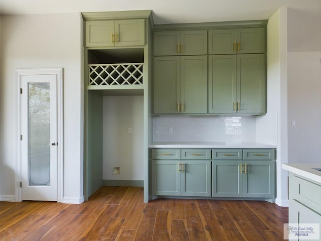 kitchen with decorative backsplash and dark hardwood / wood-style flooring