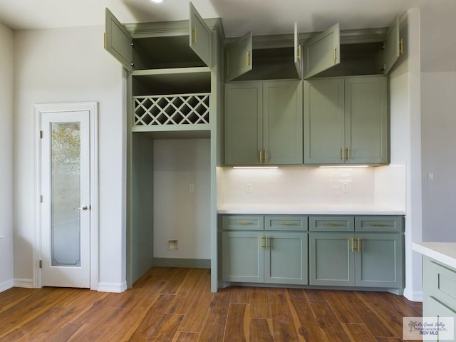 kitchen featuring dark hardwood / wood-style floors and decorative backsplash