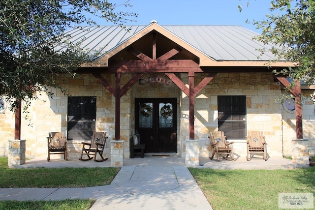 entrance to property featuring french doors