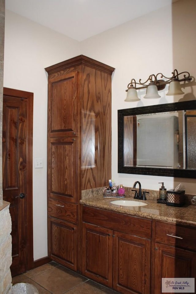 bathroom with vanity and tile patterned floors