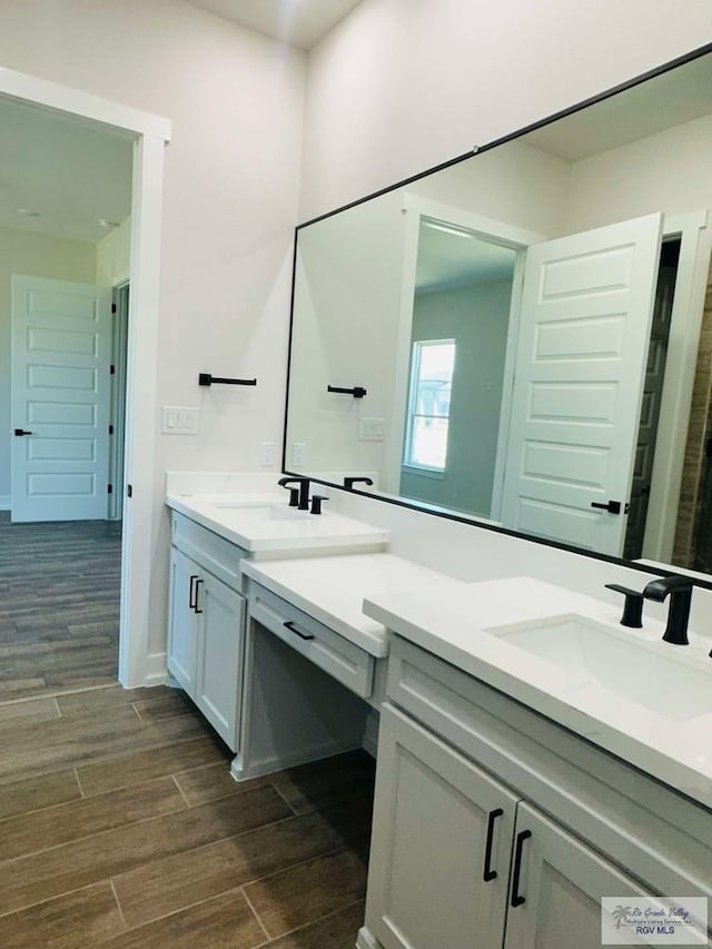3601 Mattie Ln, Harlingen, TX 78550 - full bath with double vanity and wood finished floors