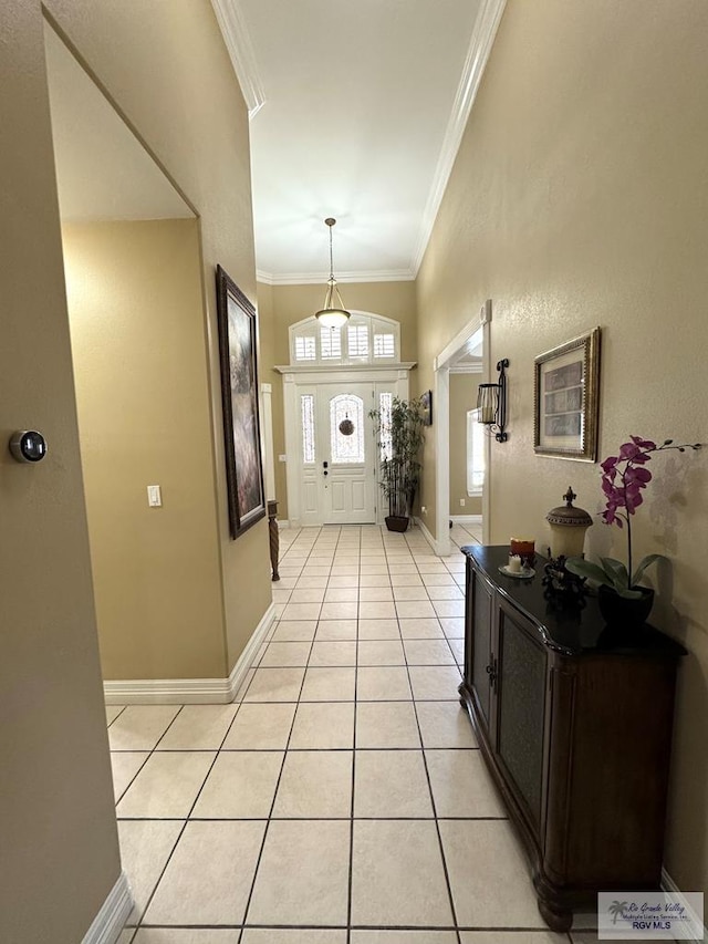 6020 Rusty Nail Dr, Brownsville, TX 78526 - foyer entrance with light tile patterned flooring and crown molding