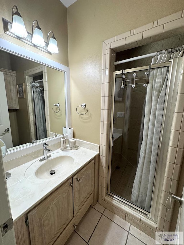 6020 Rusty Nail Dr, Brownsville, TX 78526 - bathroom featuring a shower stall, vanity, and tile patterned flooring