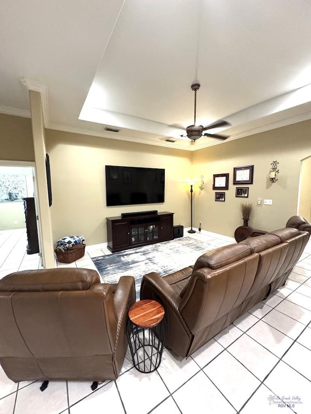 6020 Rusty Nail Dr, Brownsville, TX 78526 - living area featuring ornamental molding, light tile patterned floors, a ceiling fan, and a raised ceiling