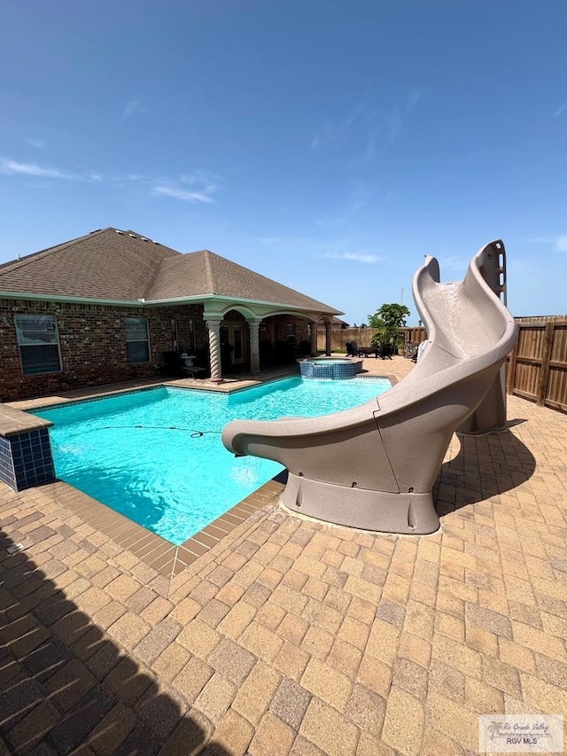 6020 Rusty Nail Dr, Brownsville, TX 78526 - view of pool with a water slide and a patio
