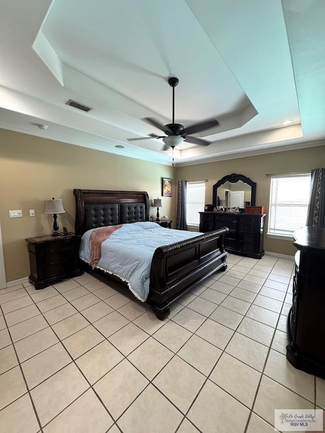 6020 Rusty Nail Dr, Brownsville, TX 78526 - bedroom featuring a tray ceiling, multiple windows, light tile patterned flooring, and ceiling fan