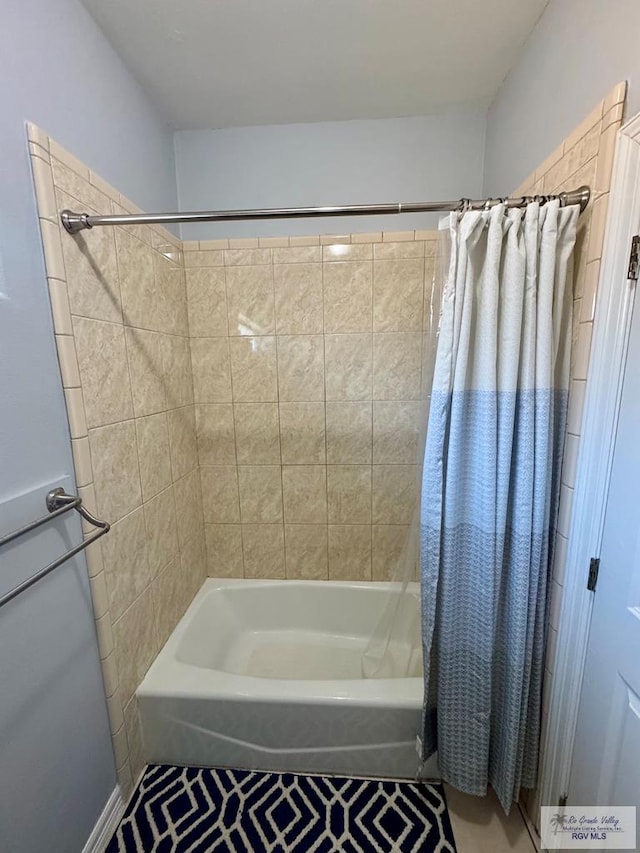 6020 Rusty Nail Dr, Brownsville, TX 78526 - bathroom with shower / tub combo and tile patterned floors