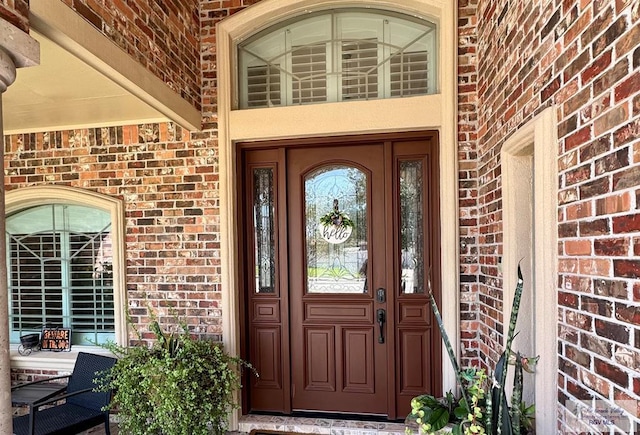 6020 Rusty Nail Dr, Brownsville, TX 78526 - view of exterior entry with brick siding and covered porch