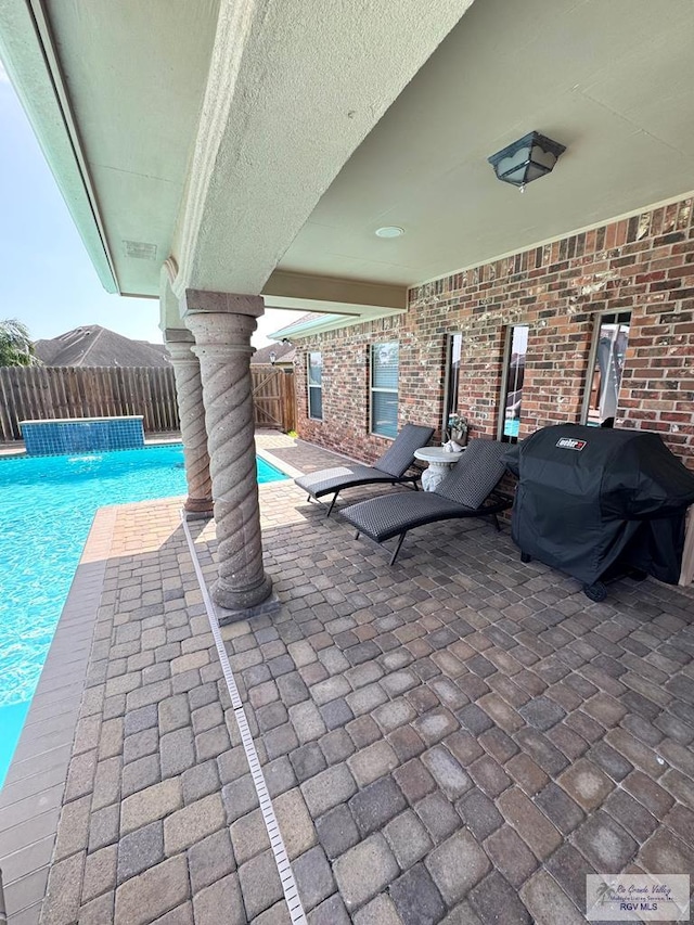 6020 Rusty Nail Dr, Brownsville, TX 78526 - fenced backyard featuring grilling area and a patio