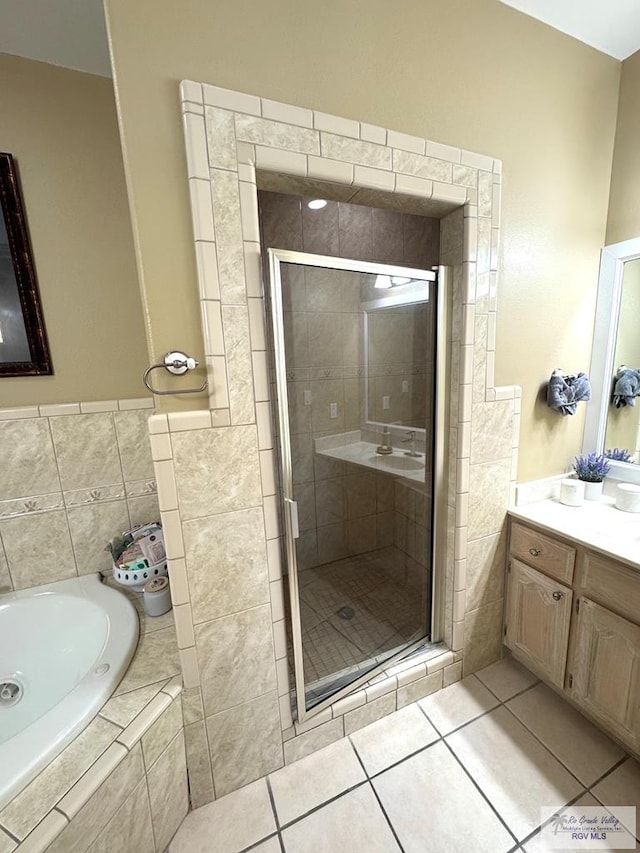 6020 Rusty Nail Dr, Brownsville, TX 78526 - bathroom featuring a garden tub, vanity, a shower stall, and tile patterned flooring
