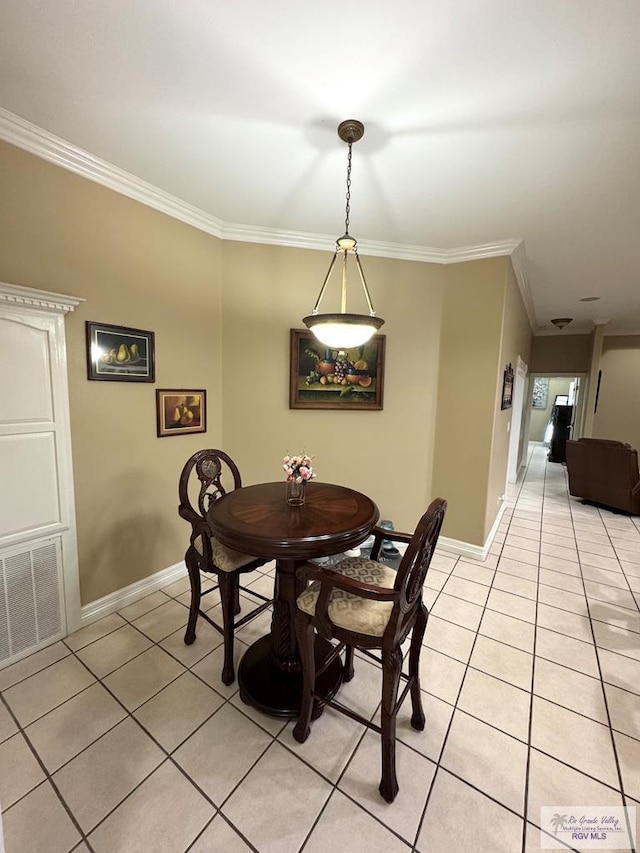 6020 Rusty Nail Dr, Brownsville, TX 78526 - dining room with light tile patterned floors and crown molding
