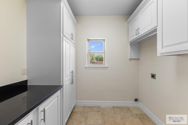 8005 King Sago Ct, Harlingen, TX 78552 - washroom with electric dryer hookup and cabinet space