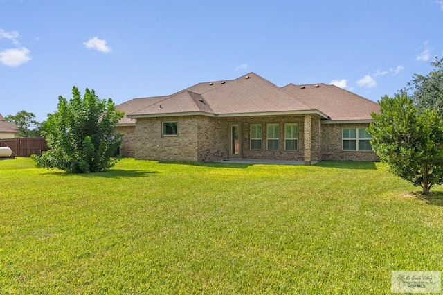 8005 King Sago Ct, Harlingen, TX 78552 - back of property featuring brick siding and a shingled roof
