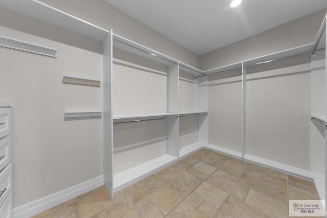 8005 King Sago Ct, Harlingen, TX 78552 - spacious closet with light stone finish floors