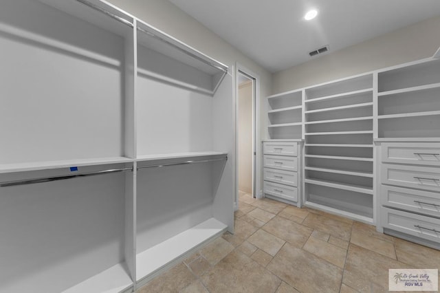 8005 King Sago Ct, Harlingen, TX 78552 - walk in closet with stone tile floors