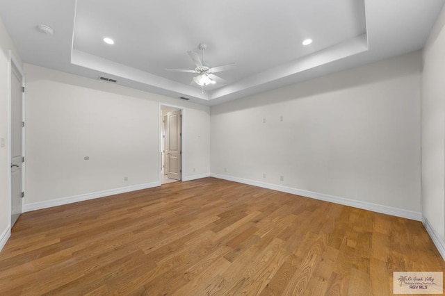 8005 King Sago Ct, Harlingen, TX 78552 - spare room featuring a raised ceiling, a ceiling fan, light wood-style flooring, recessed lighting, and a smoke detector
