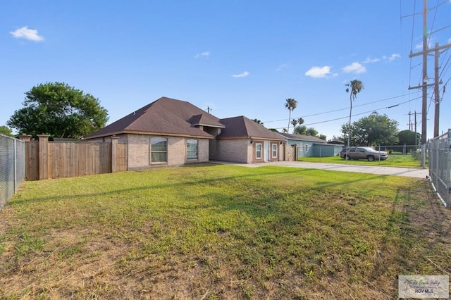 6540 Dockberry Rd, Brownsville, TX 78521 - view of front facade with concrete driveway and a fenced backyard