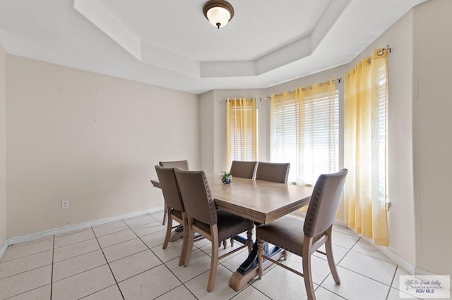 6540 Dockberry Rd, Brownsville, TX 78521 - dining room with a raised ceiling and light tile patterned floors