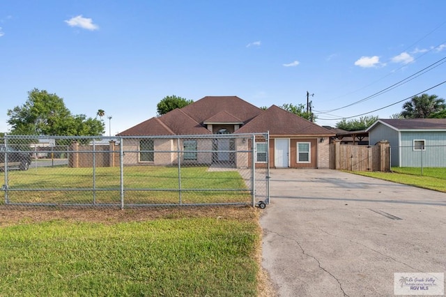 6540 Dockberry Rd, Brownsville, TX 78521 - ranch-style house featuring a gate and driveway
