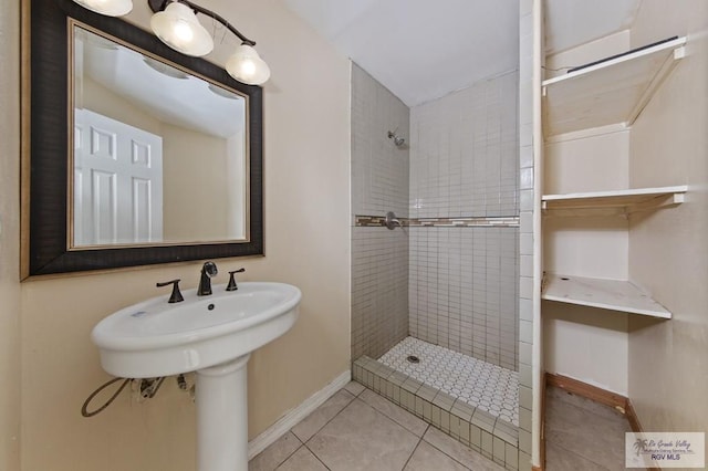 6540 Dockberry Rd, Brownsville, TX 78521 - bathroom featuring tiled shower and tile patterned flooring