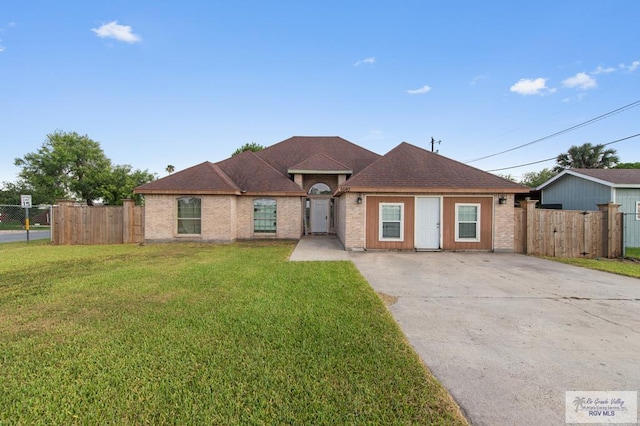 6540 Dockberry Rd, Brownsville, TX 78521 - view of front of house with driveway and brick siding