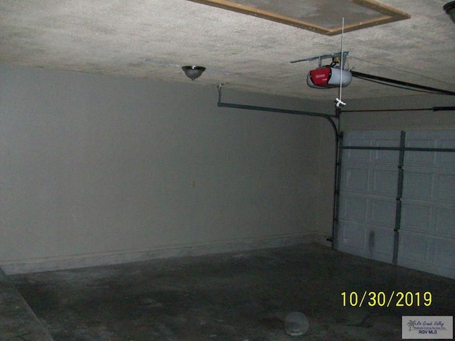 garage featuring a garage door opener