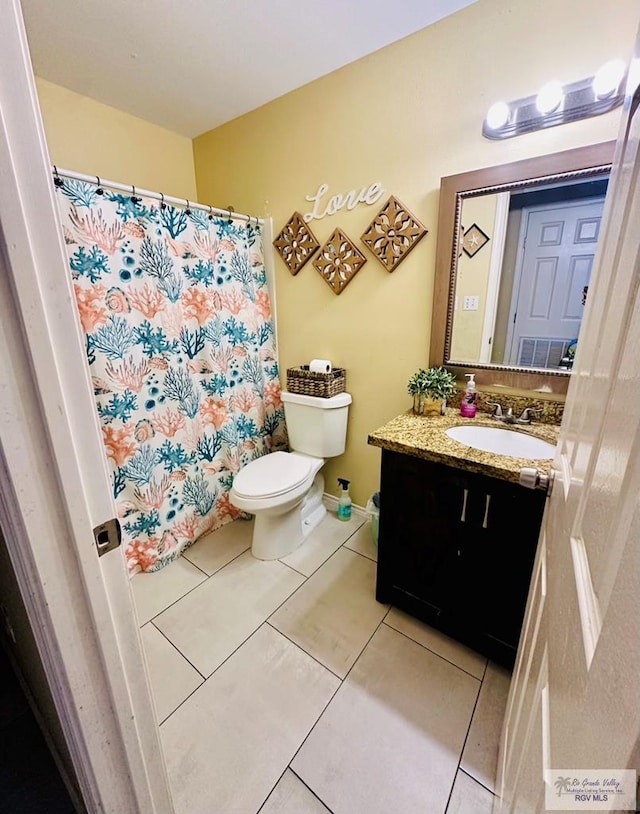 2 Woodstone Dr, Brownsville, TX 78526 - bathroom featuring toilet, vanity, curtained shower, and tile patterned floors