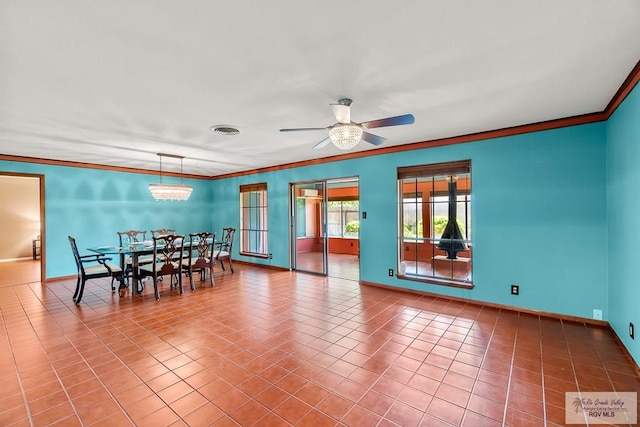 dining room featuring tile patterned floors, ceiling fan, and ornamental molding