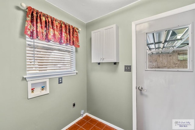 clothes washing area featuring cabinets, hookup for a washing machine, tile patterned flooring, and electric dryer hookup