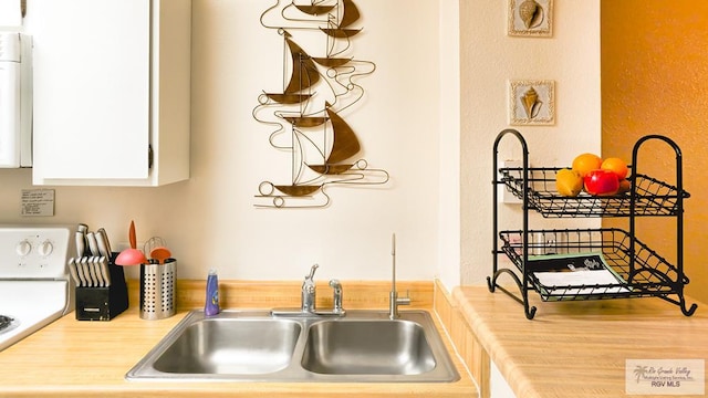 kitchen with sink and white cabinets