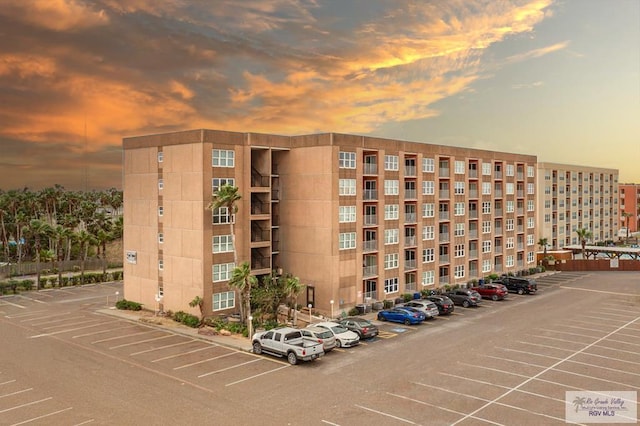 view of outdoor building at dusk