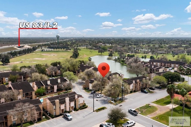 bird's eye view with a water view and a residential view