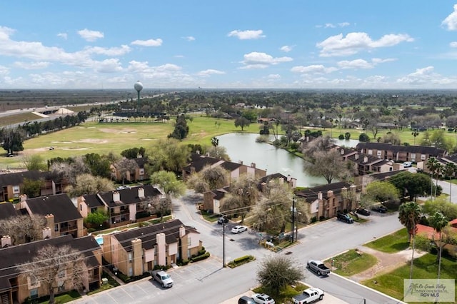 birds eye view of property with a residential view and a water view