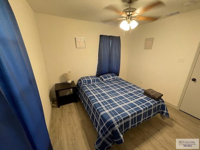 bedroom featuring ceiling fan and light wood-type flooring