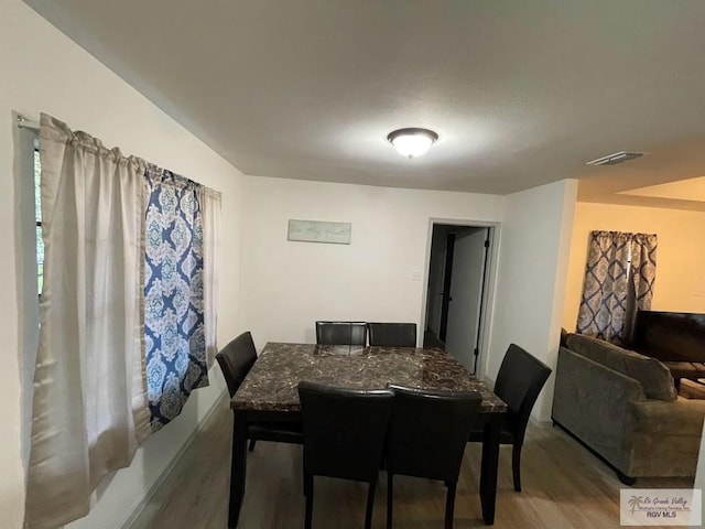 dining room featuring hardwood / wood-style floors