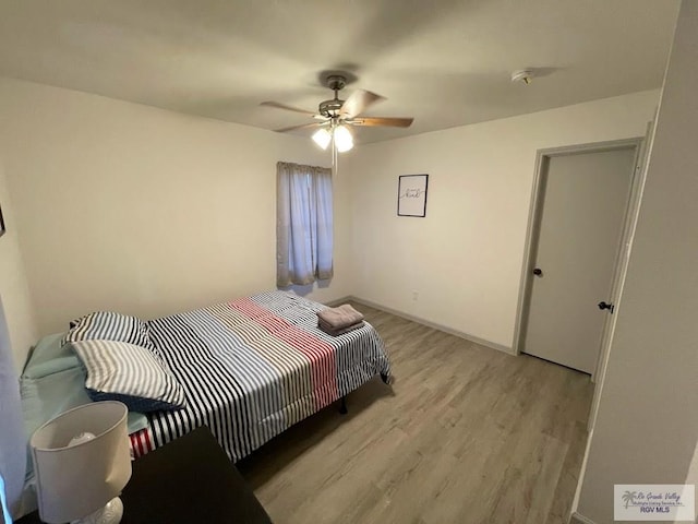 bedroom with ceiling fan and light wood-type flooring