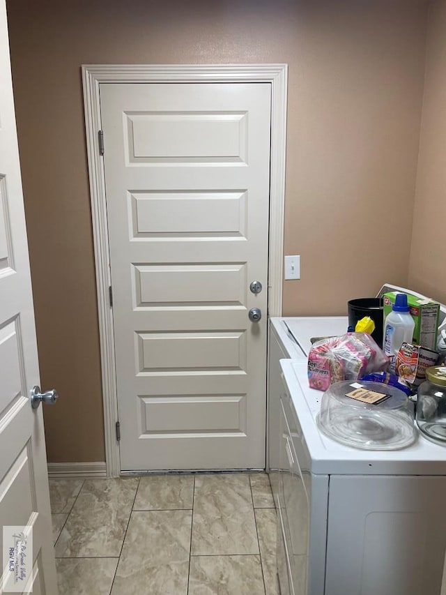 washroom featuring washer and dryer