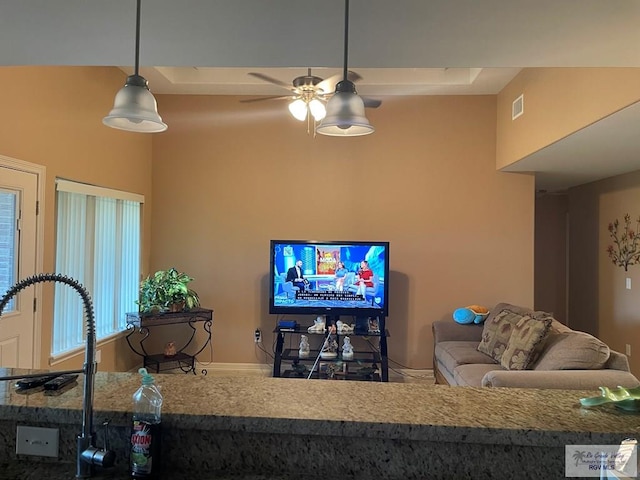 living room with ceiling fan